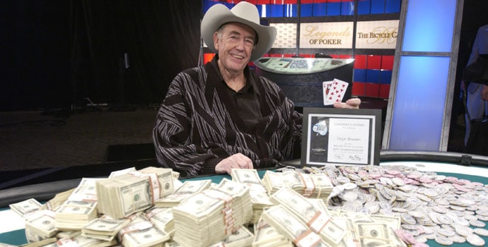 Doyle Brunson with table full of money he won in poker