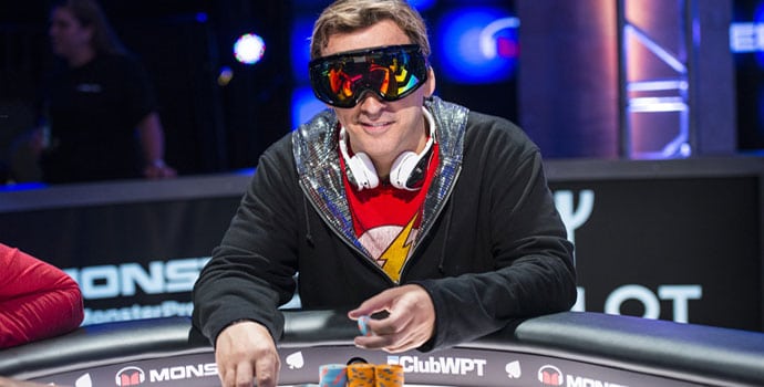 Phil Laak at the poker table wearing ski glasses